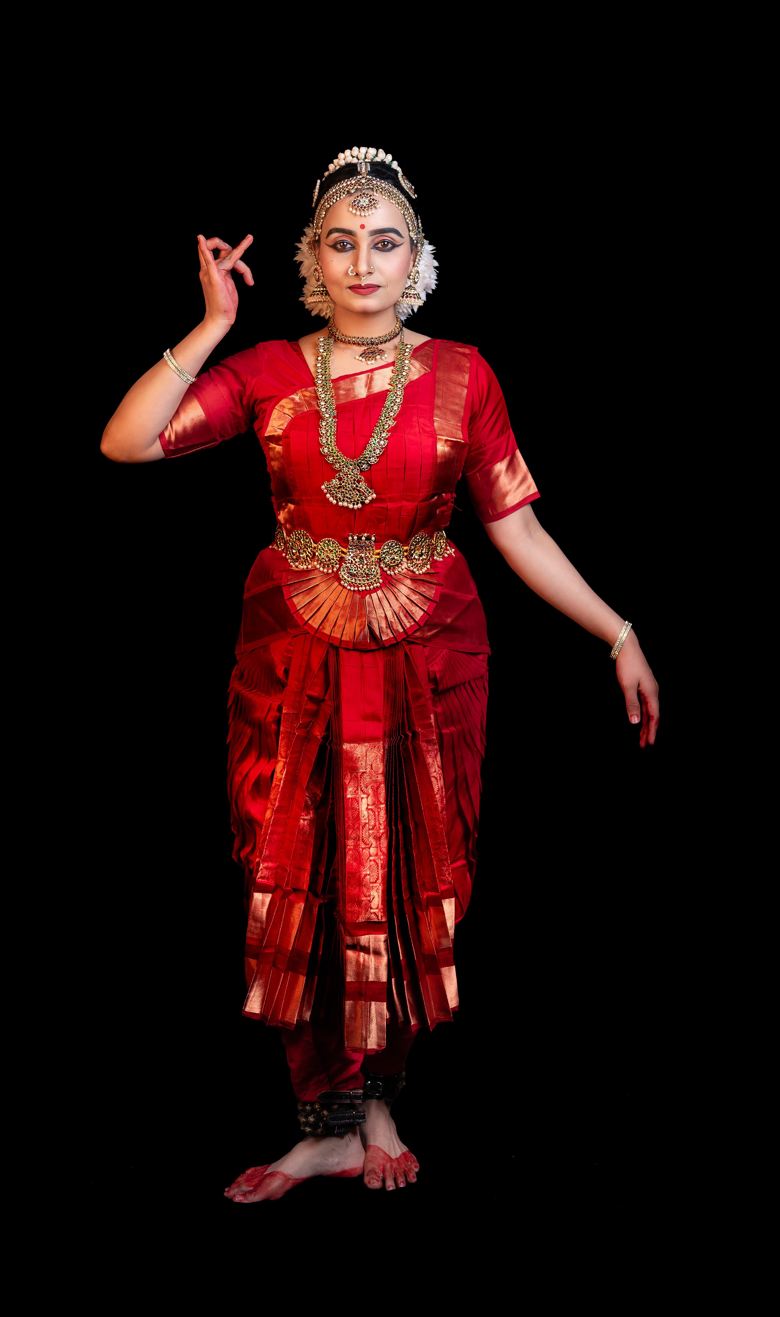 Sherin Jose in a devotional standing mudra pose